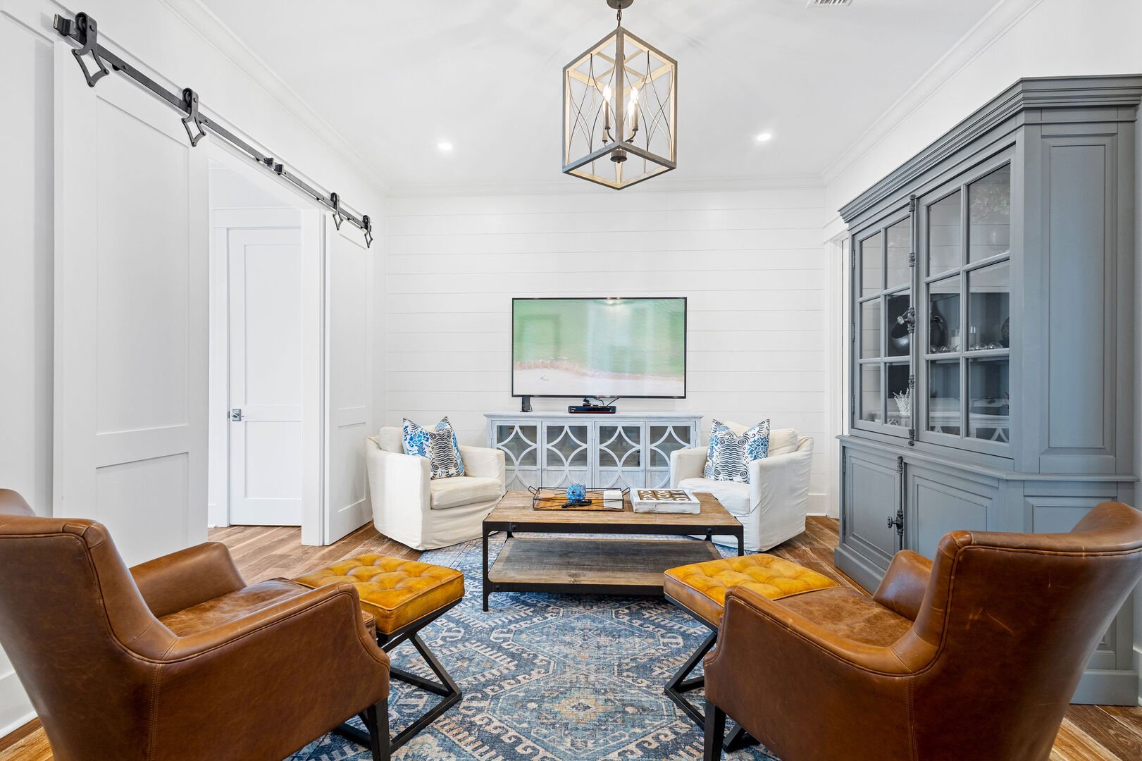 First floor living space features seating and a smart tv. Perfect for unwinding before bed.