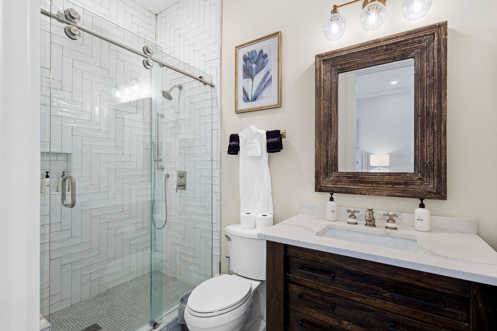 Bathroom includes a walk-in shower.