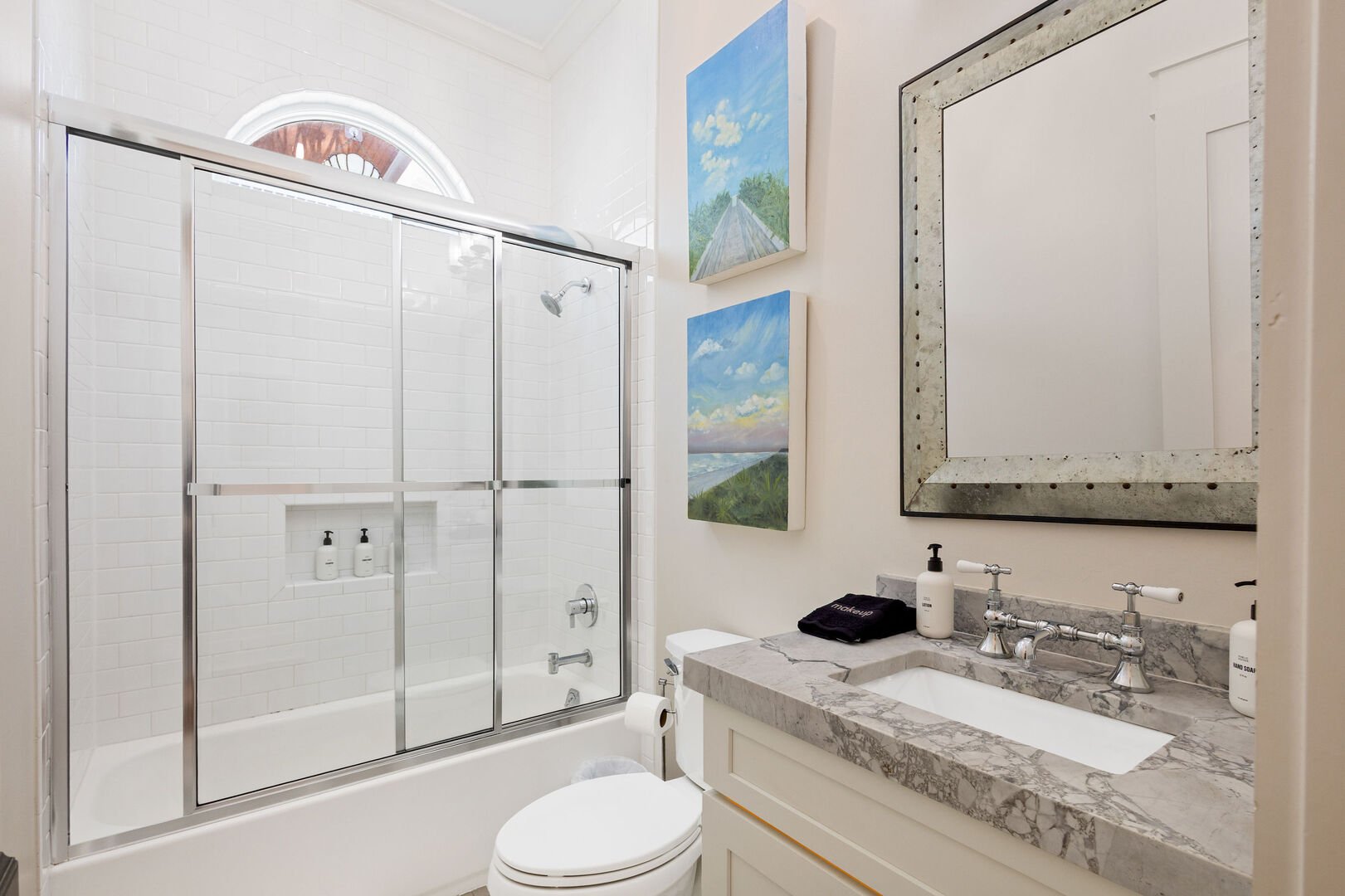 Second floor bathroom features a shower/tub combo.