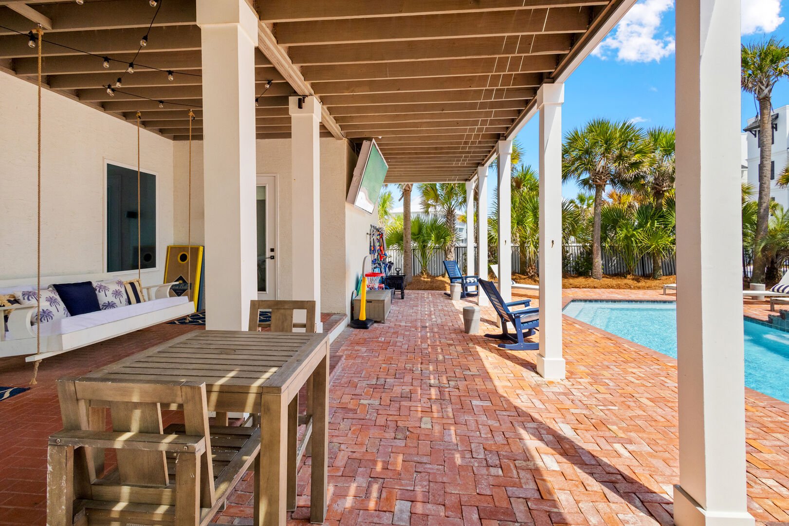 Back patio features plenty of seating areas, perfect for entertaining.