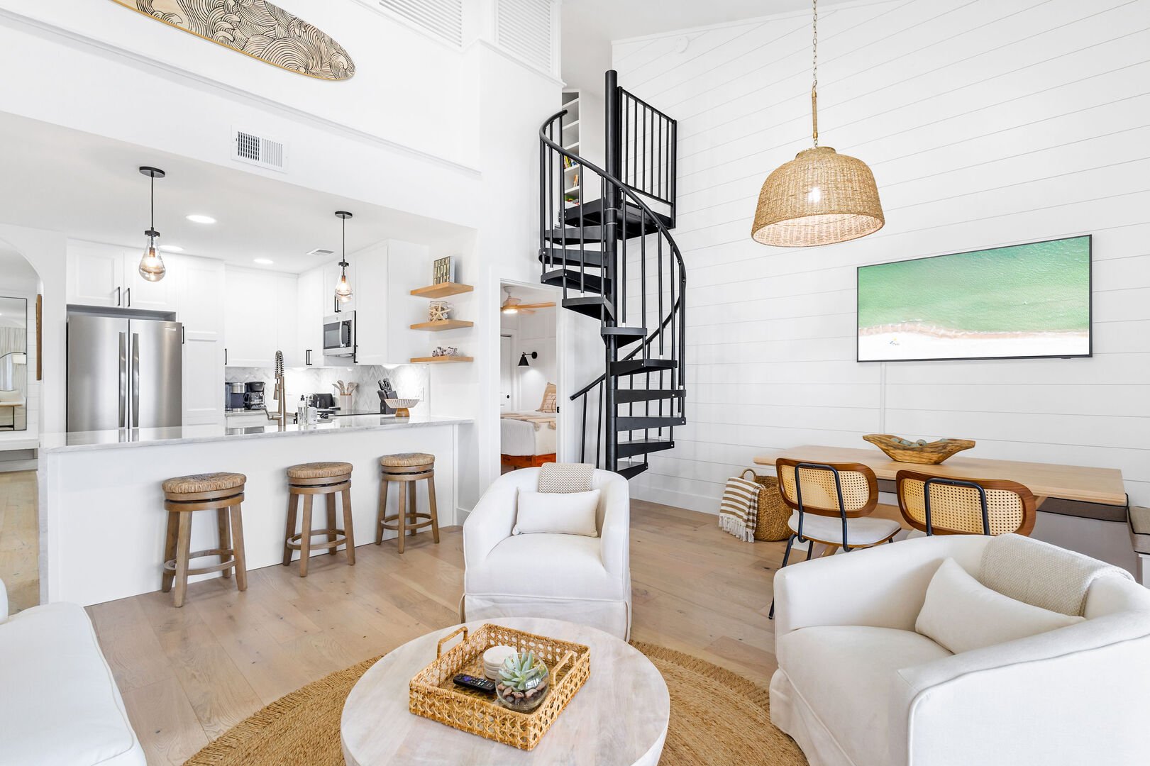 Living room includes ample seating and a smart tv. Perfect for winding down in the evenings.