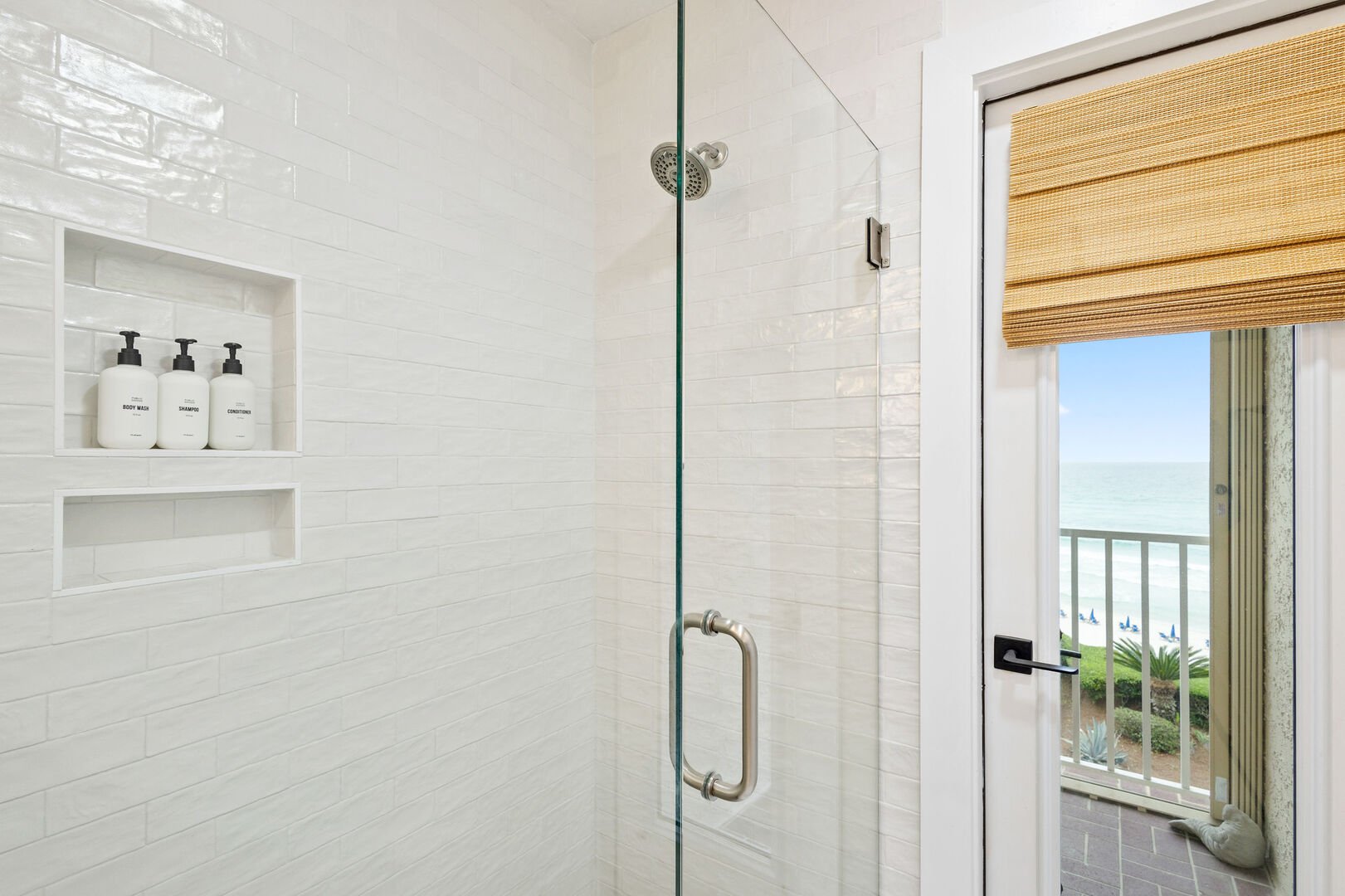 Bathroom includes access to balcony.