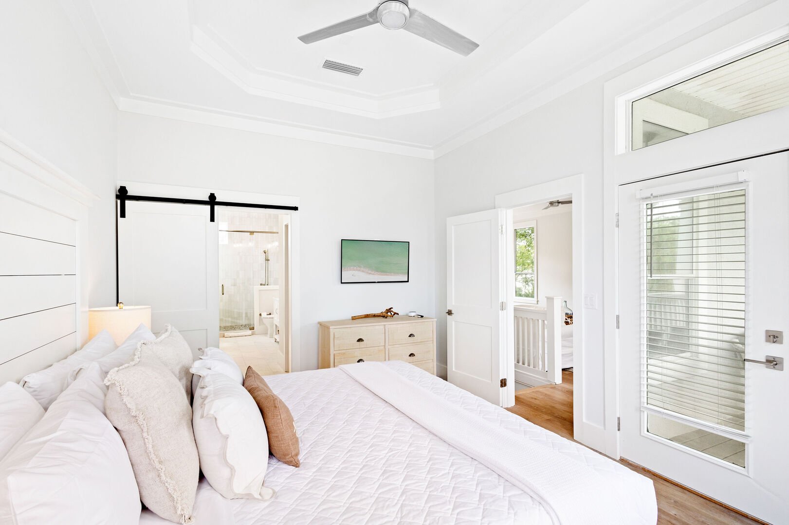 Bedroom features a smart tv, ensuite and walkout to balcony.