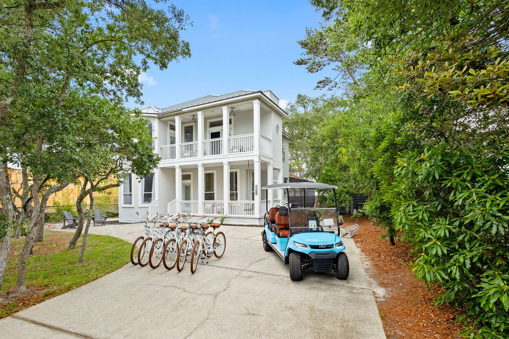 Home features a 6-seater golf cart, 6 adult bikes and driveway parking for 4!