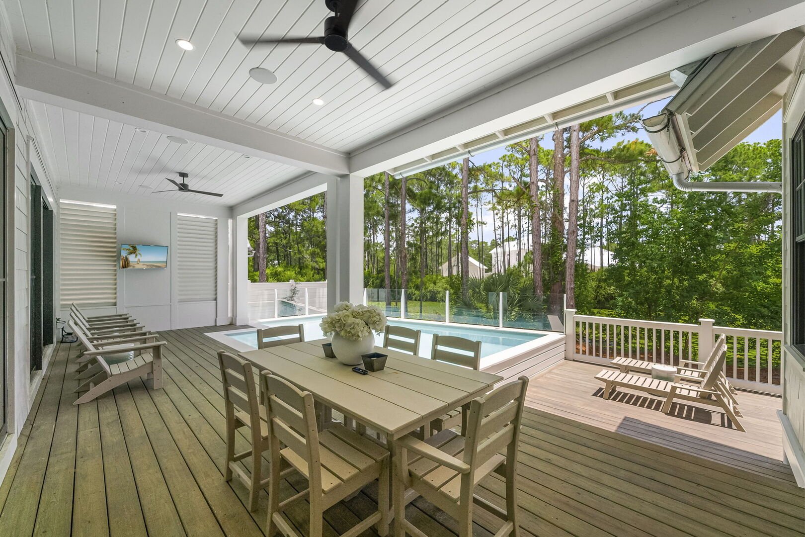 Back deck features dining and lounging areas.