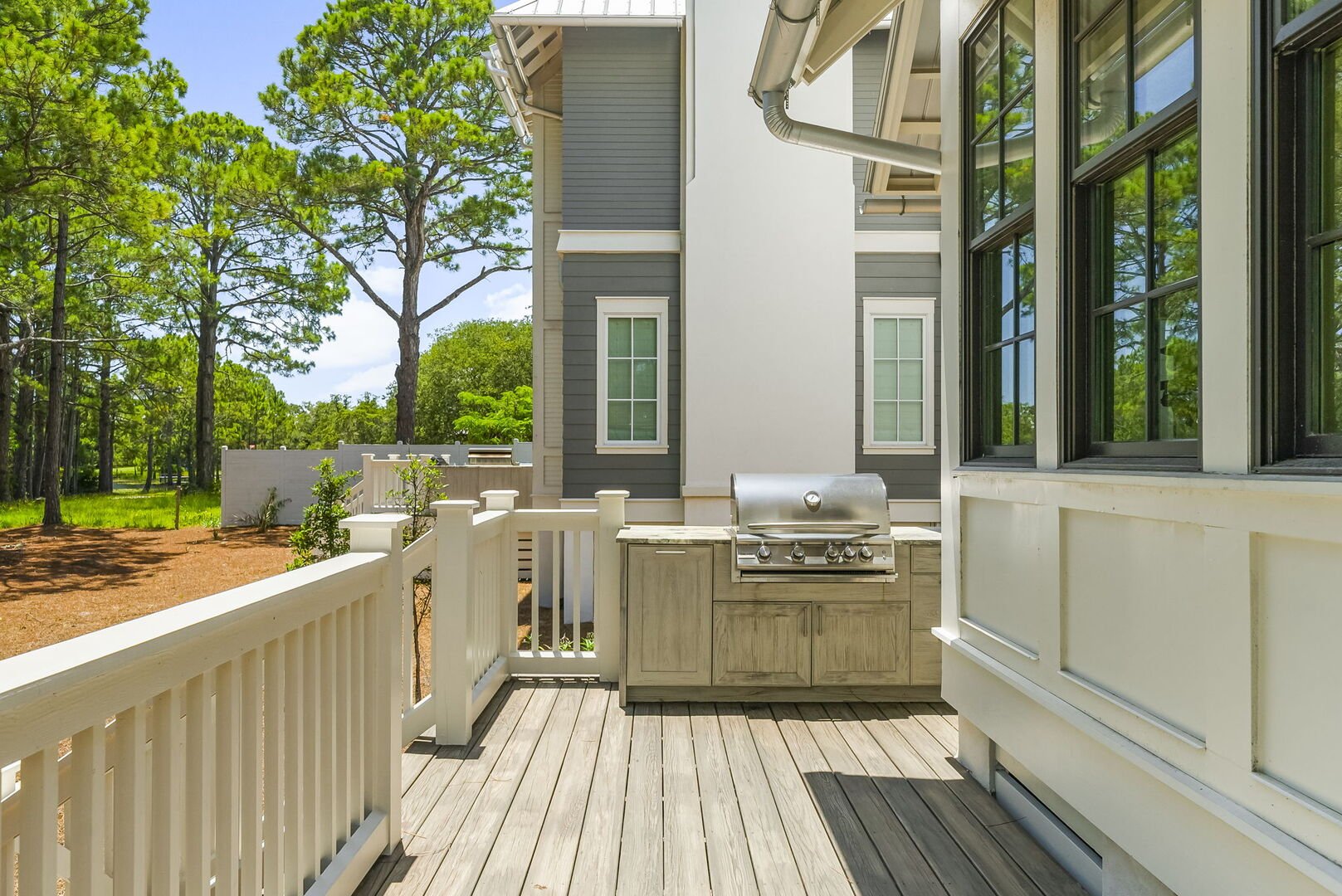 Deck features a built-in gas grill. Perfect for pool side cookouts!
