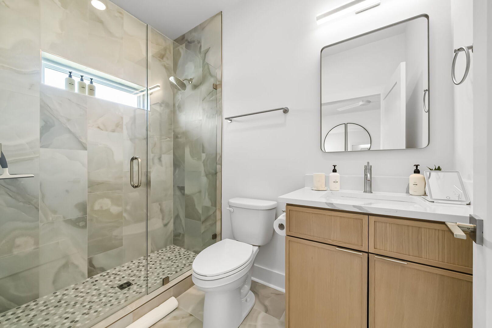 Ensuite with single vanity, walk-in shower.