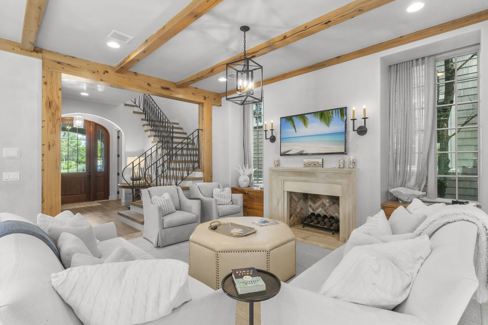 Modern coastal living room with direct access to a screened patio.