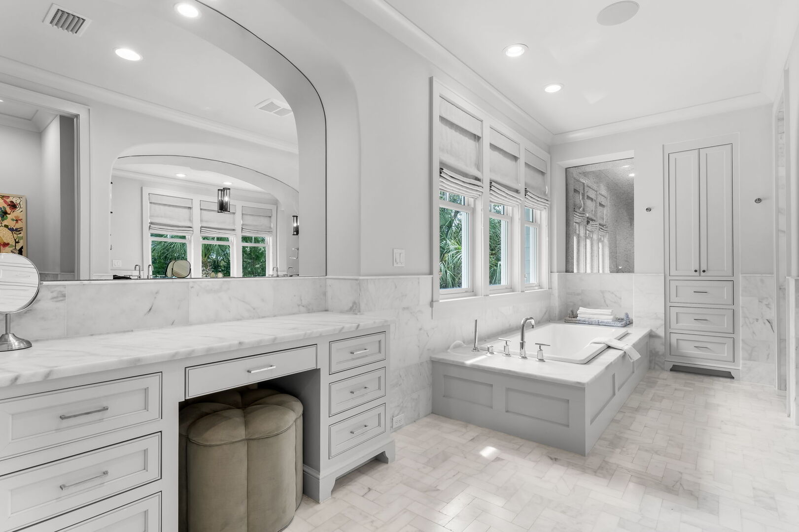 Bathroom features walk-in shower and soaking tub.