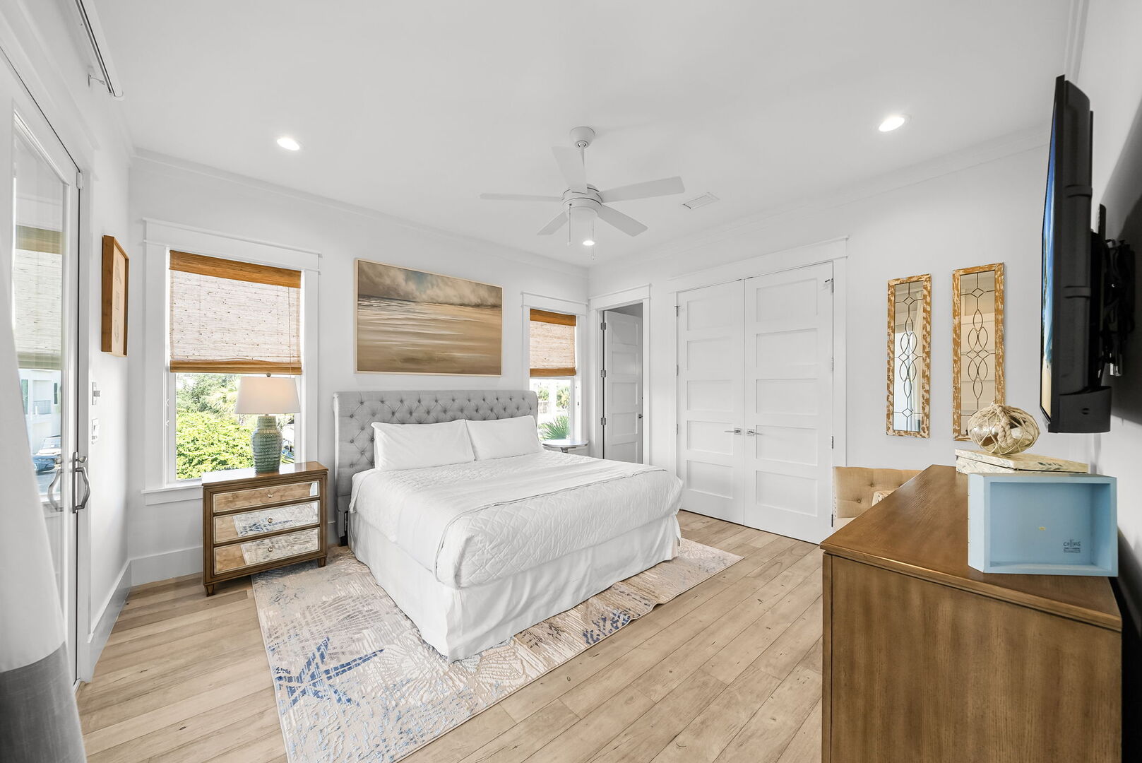 Bedroom #3 features a king bed, smart TV, and ensuite, with access to screened in porch.