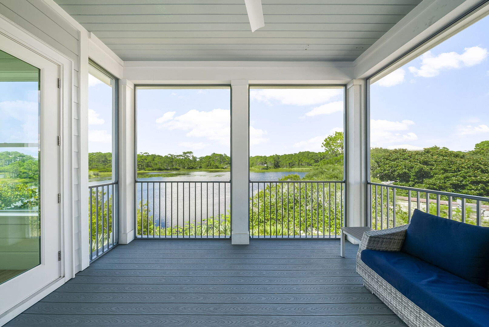 The 2nd floor offers a large private screened in porch w/ seating & a swing, perfect for morning coffee & taking in the lake views.