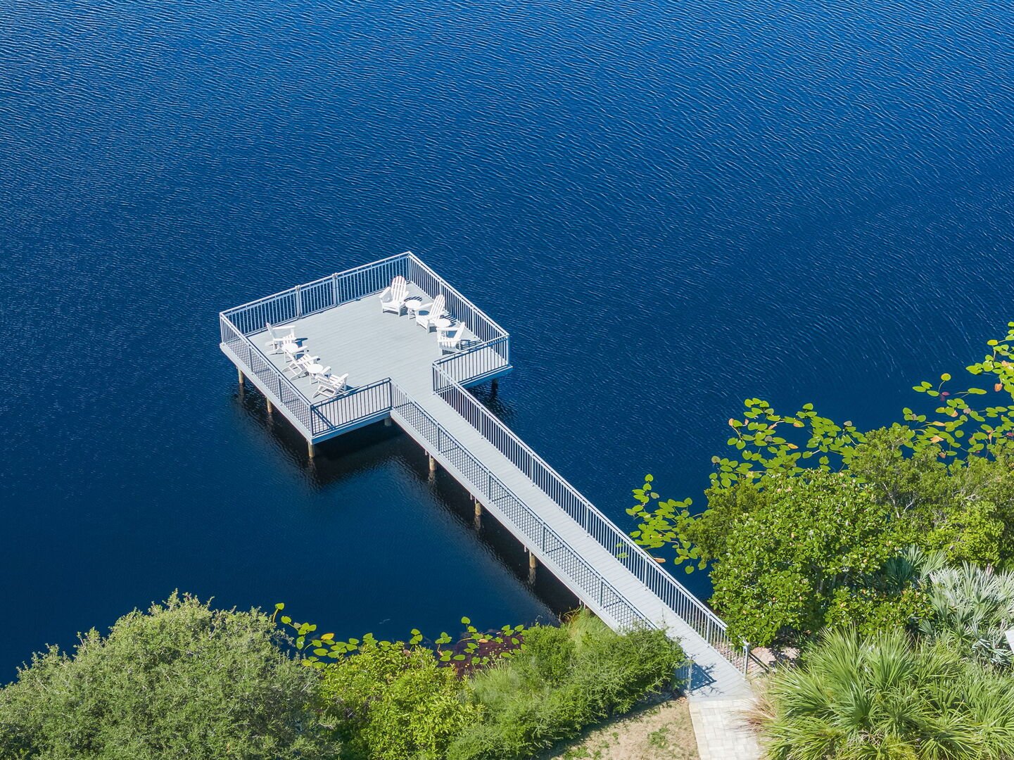 Home features an outdoor deck over the dune lake with seating, perfect for morning coffee and 30A sunsets.