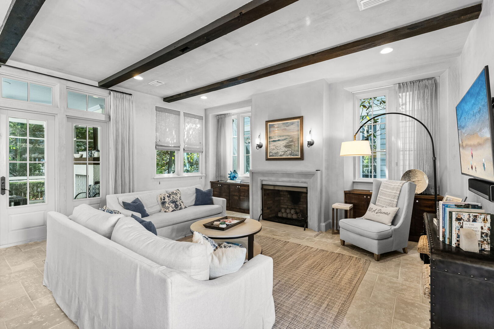 Modern coastal living room with direct access to a screened patio.