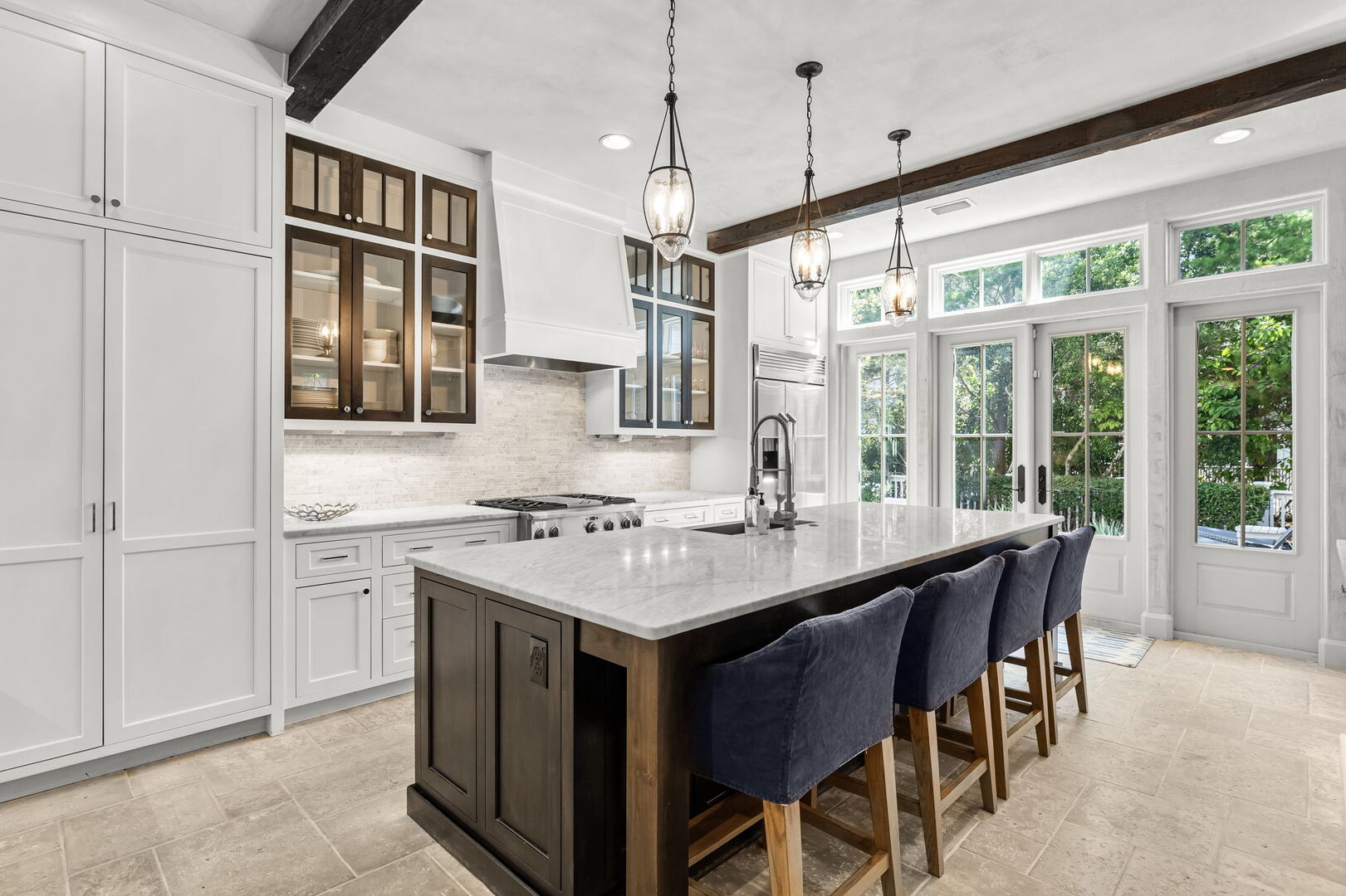 Fully stocked kitchen with island seating for 4. Perfect for preparing family meals!
