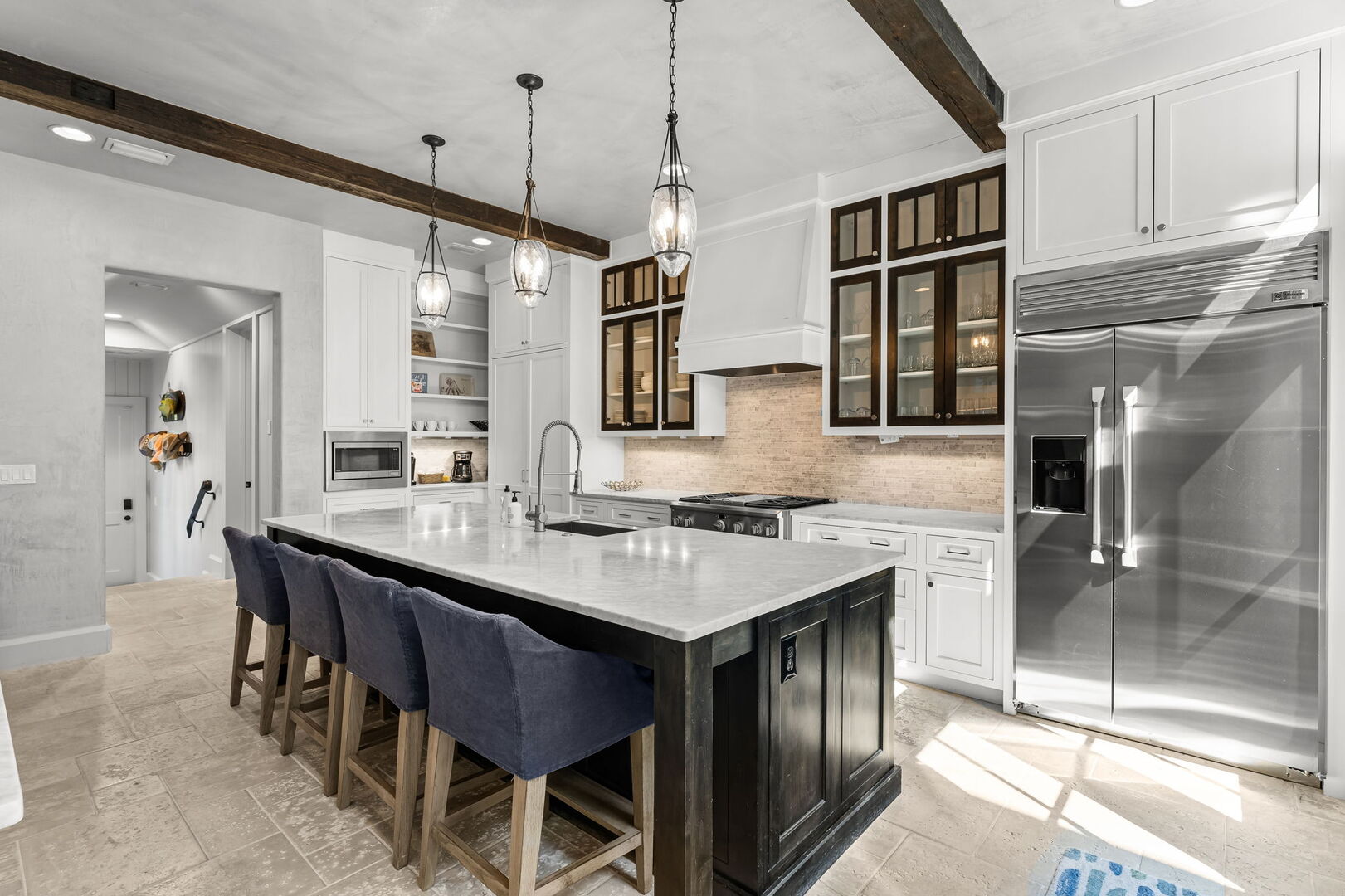 Fully stocked kitchen with island seating for 4. Perfect for preparing family meals!