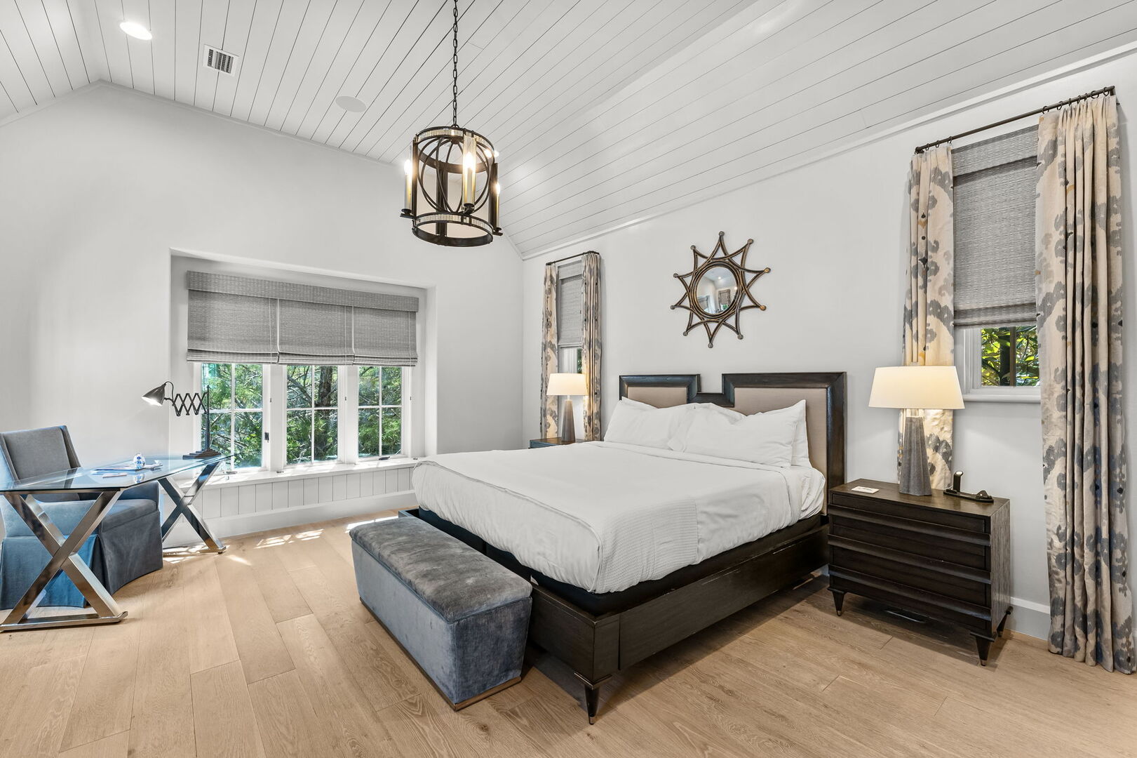 Bedroom #4 features a king with ensuite, walk-in closet, & smart tv.