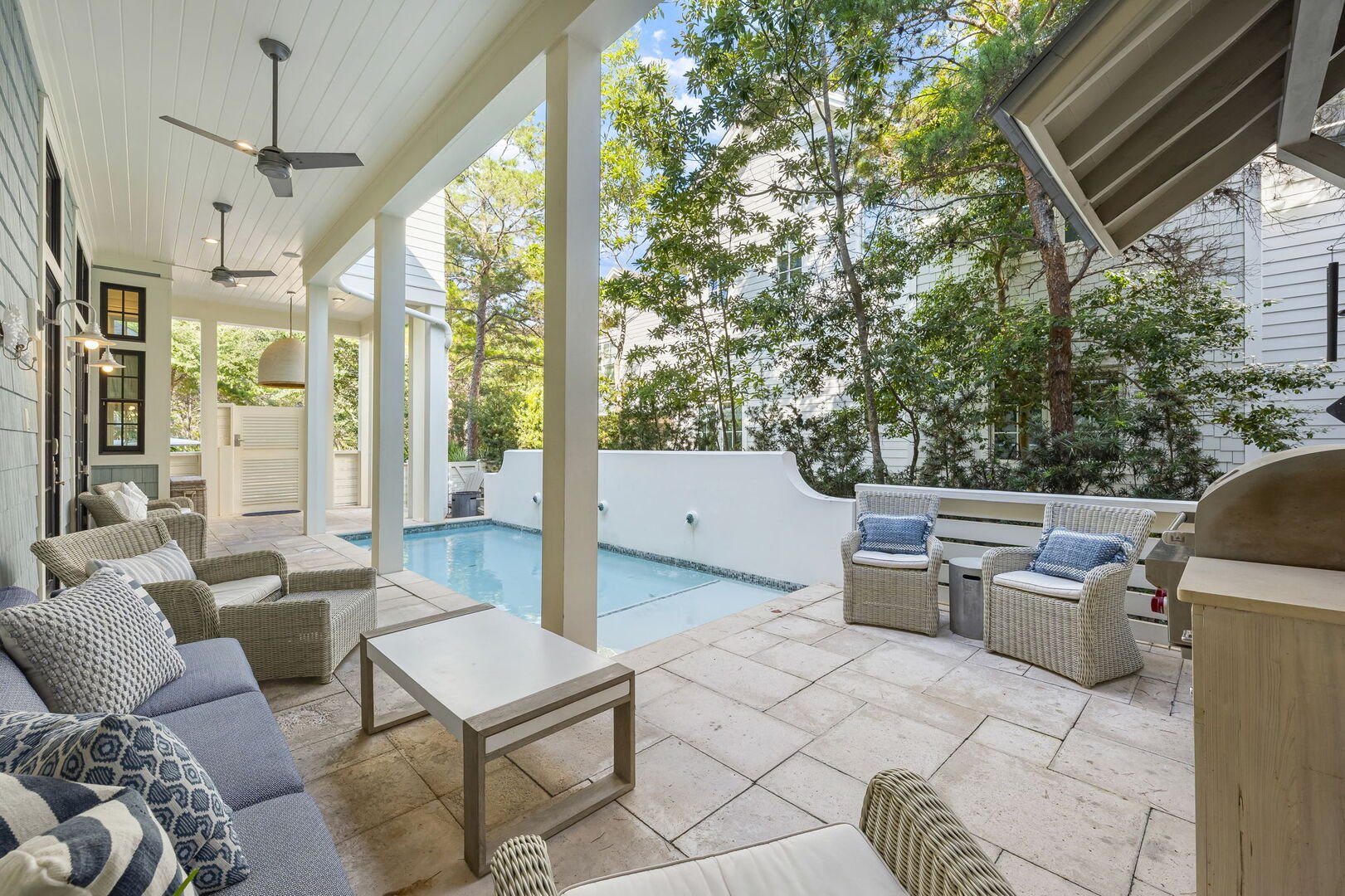 Private pool with outdoor seating & gas grill.