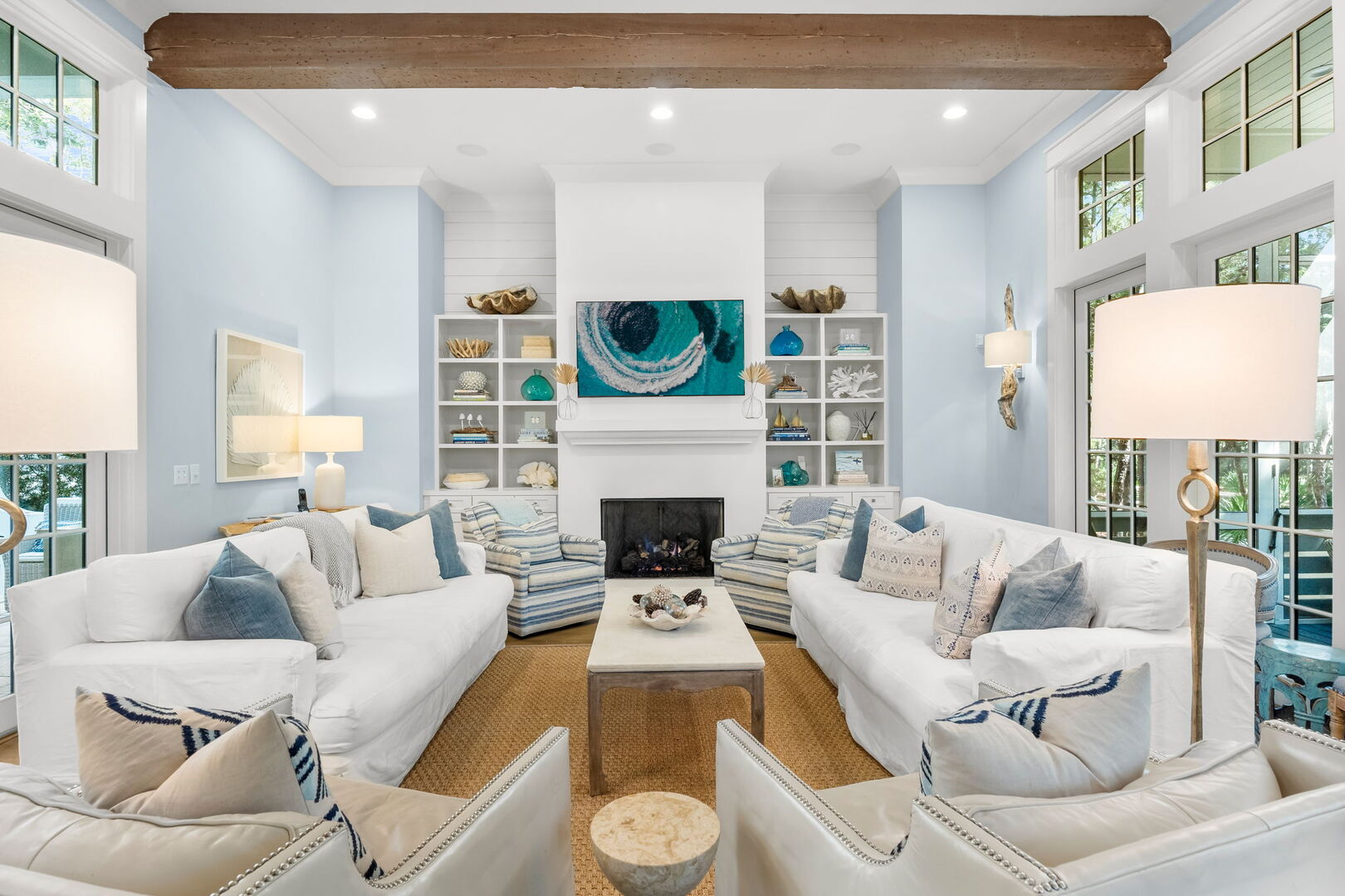 Modern coastal living room with direct access to back patio.