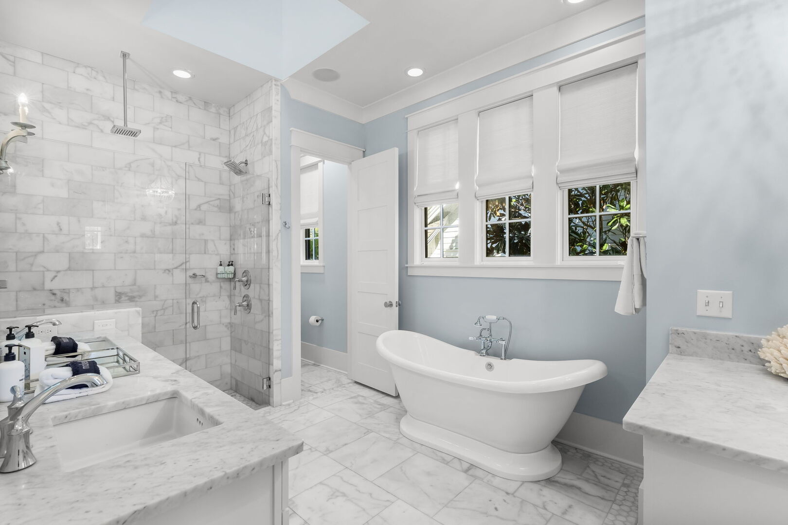 Ensuite bathroom with dual vanities, soaking tub, & walk-in shower.