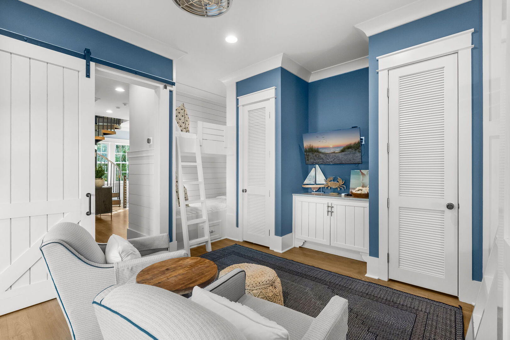 Bedroom #4 features (2) Twin-over-Twin bunks, with access to porch and smart tv.