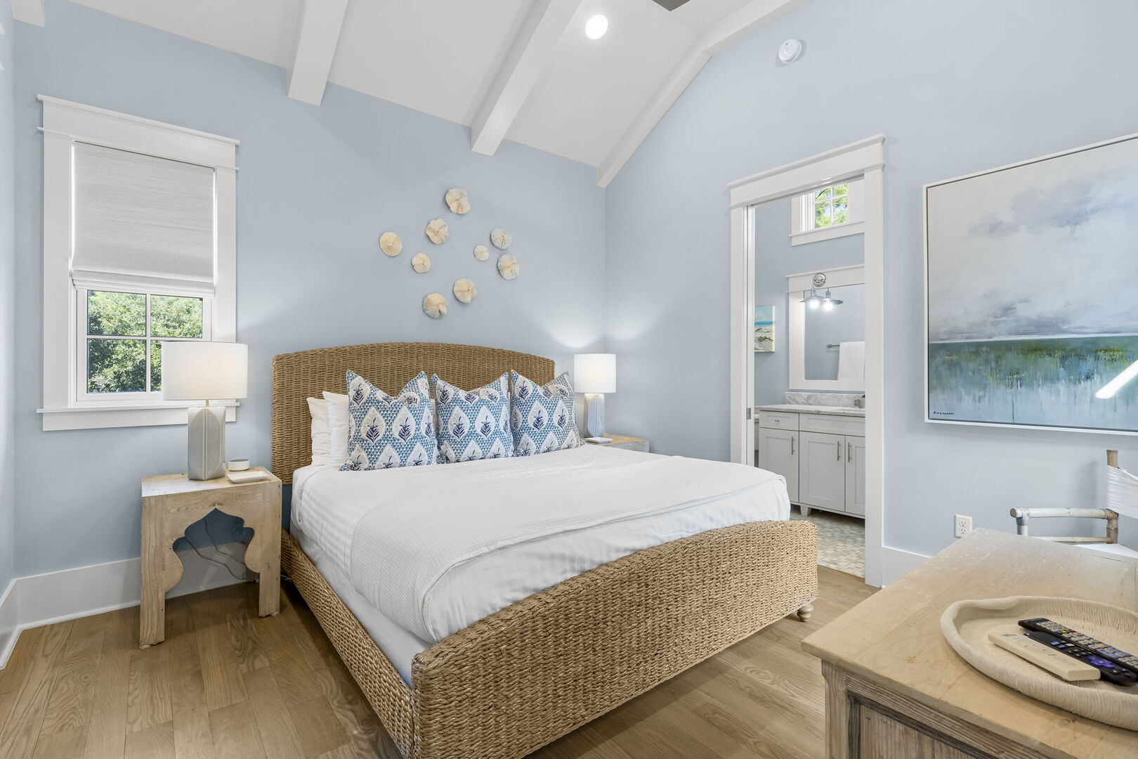 Bedroom #2 features king bed, with ensuite, access to porch, & smart tv.