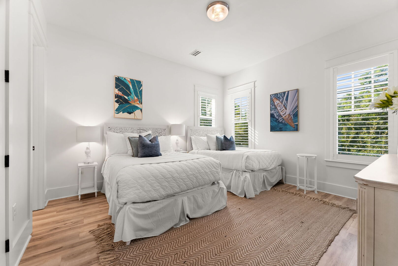 Bedroom #2 features (2) queen beds, with ensuite & smart tv.