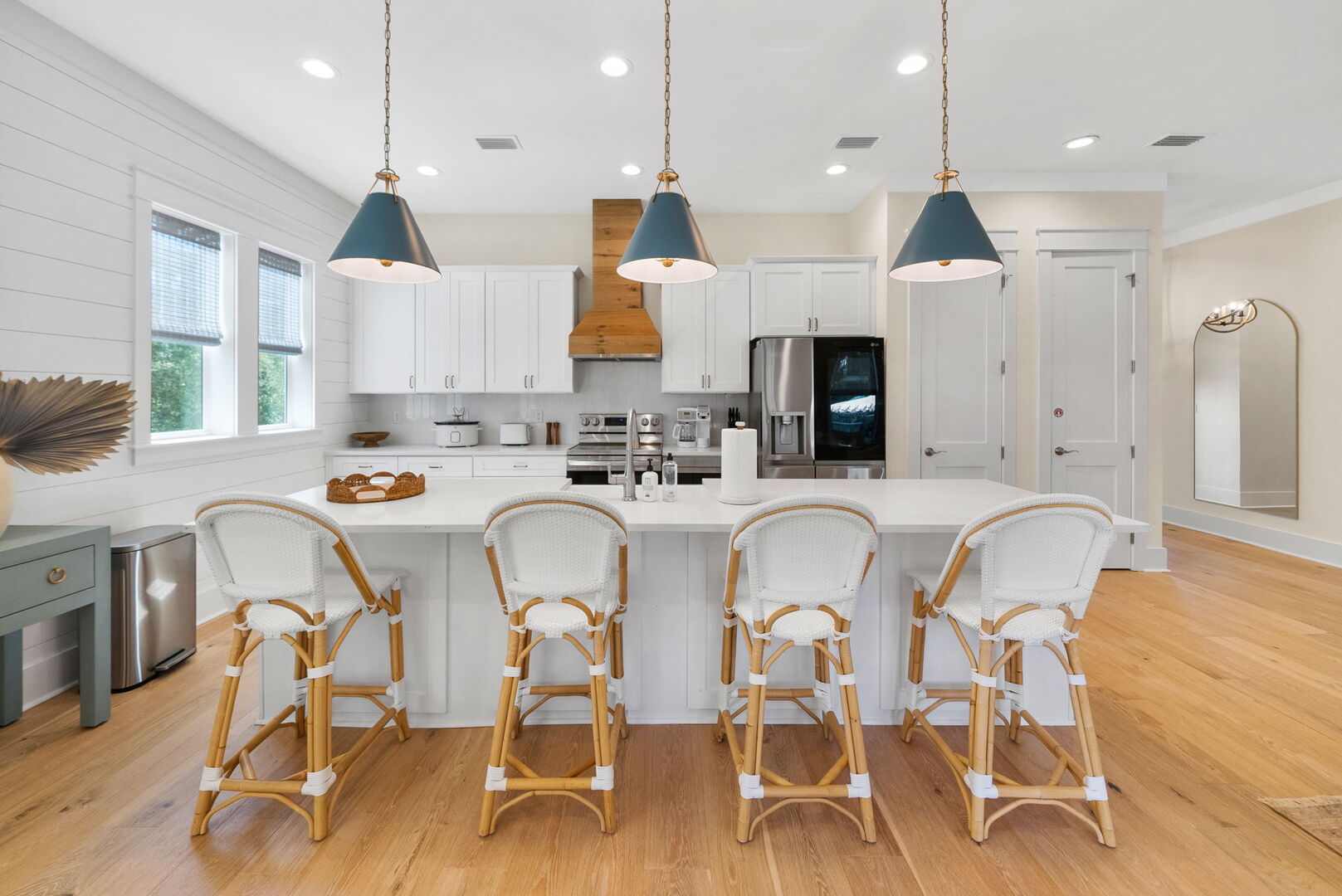 Large kitchen island includes seating for an additional four.