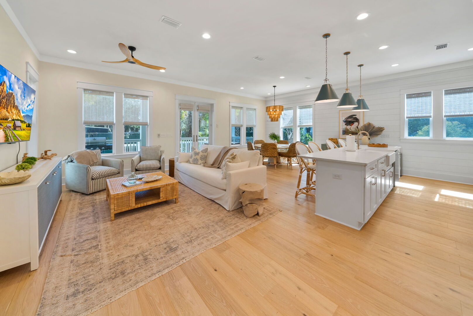 Living room includes plenty of seating for all.