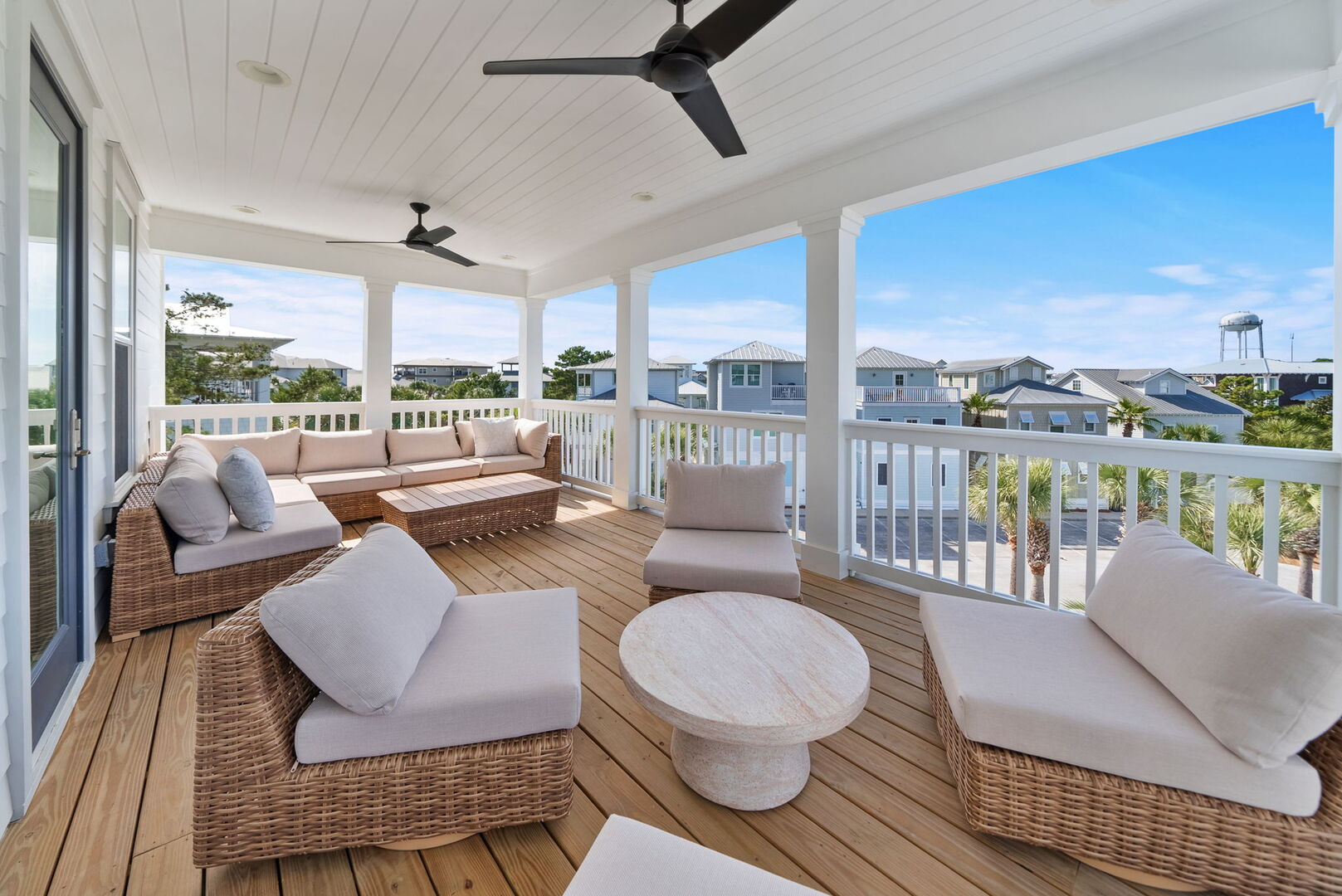 Home features multi-level covered porches with seating for all.