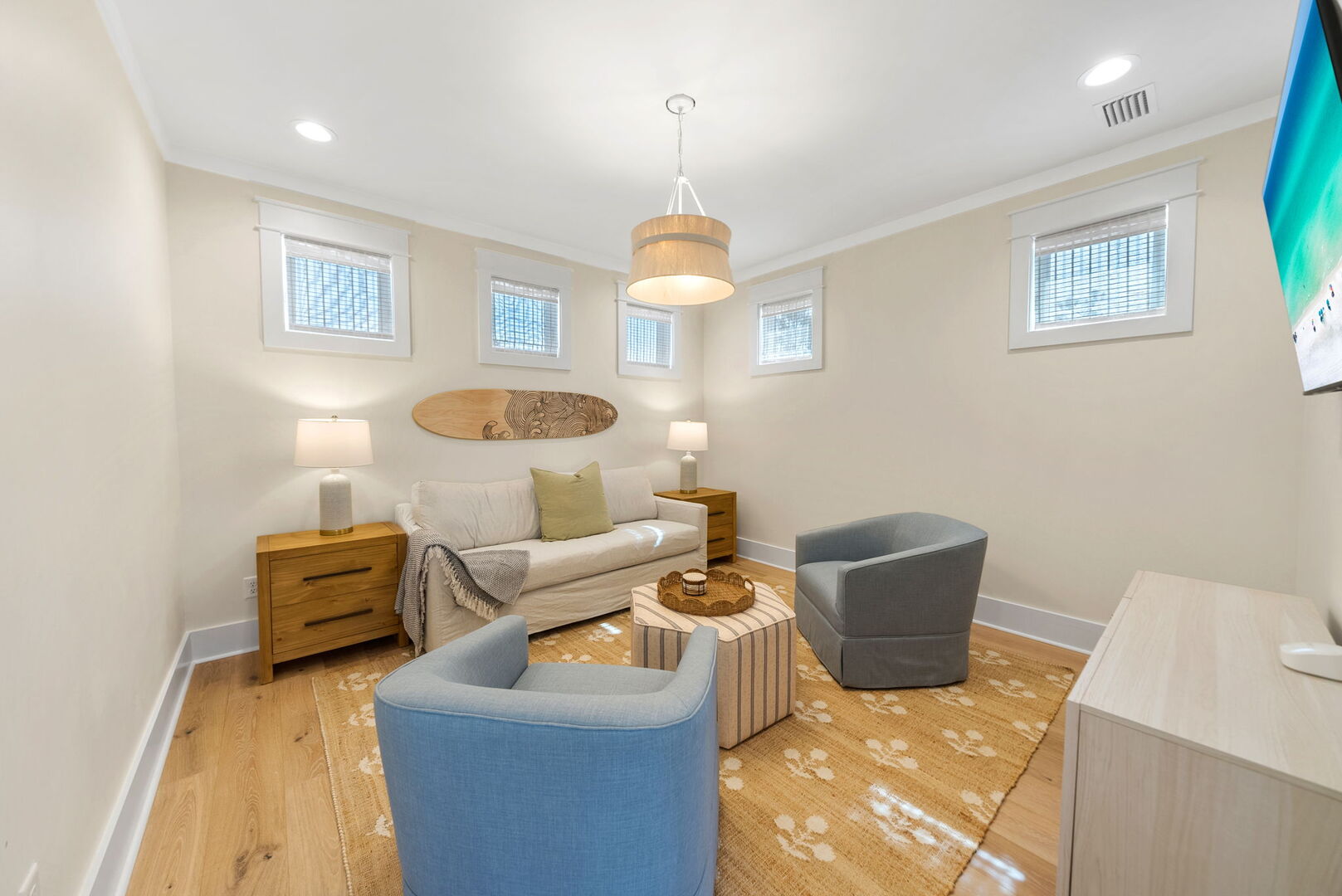 Third floor loft space with seating & smart tv.