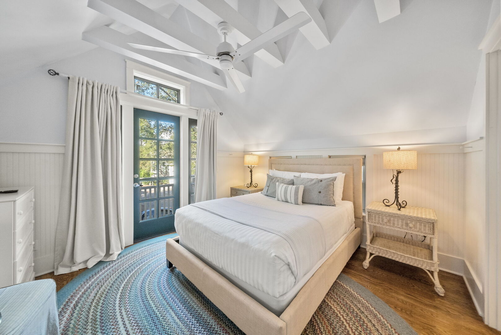 Bedroom #4 (Carriage House) features Queen, with ensuite, smart tv, and access to porch.