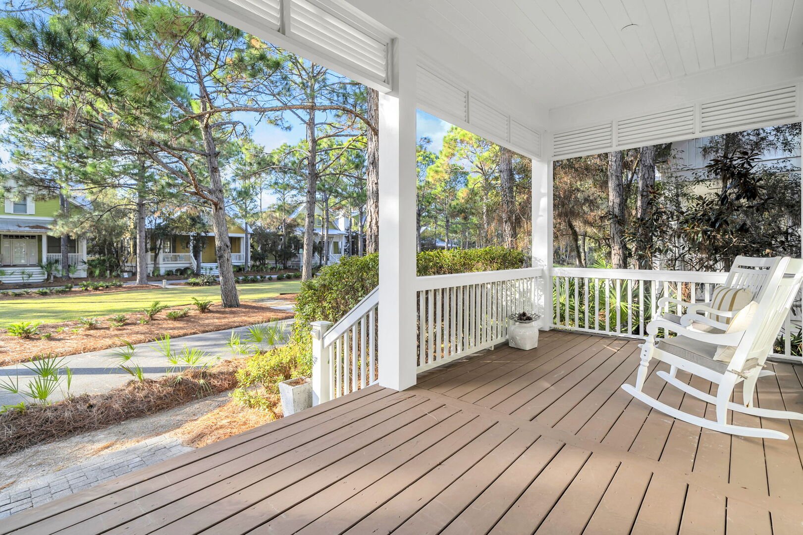 Front porch overlooks community green space.