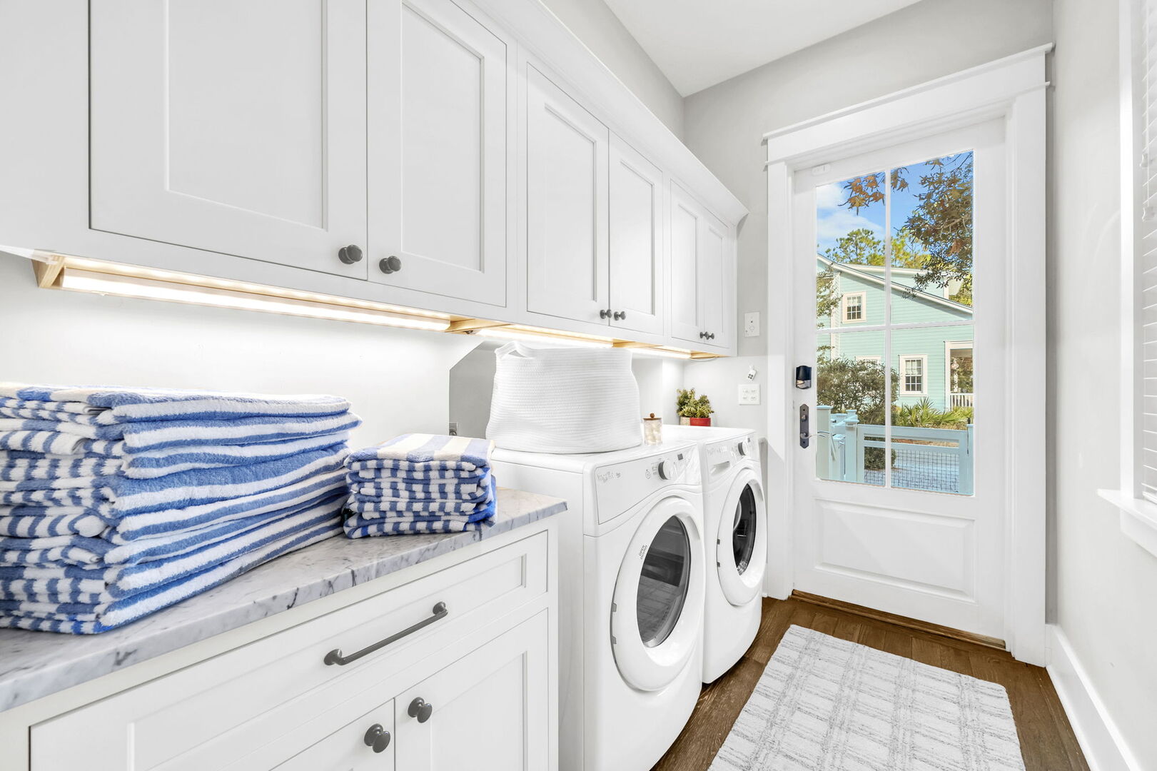 Laundry room leads out to back patio.
