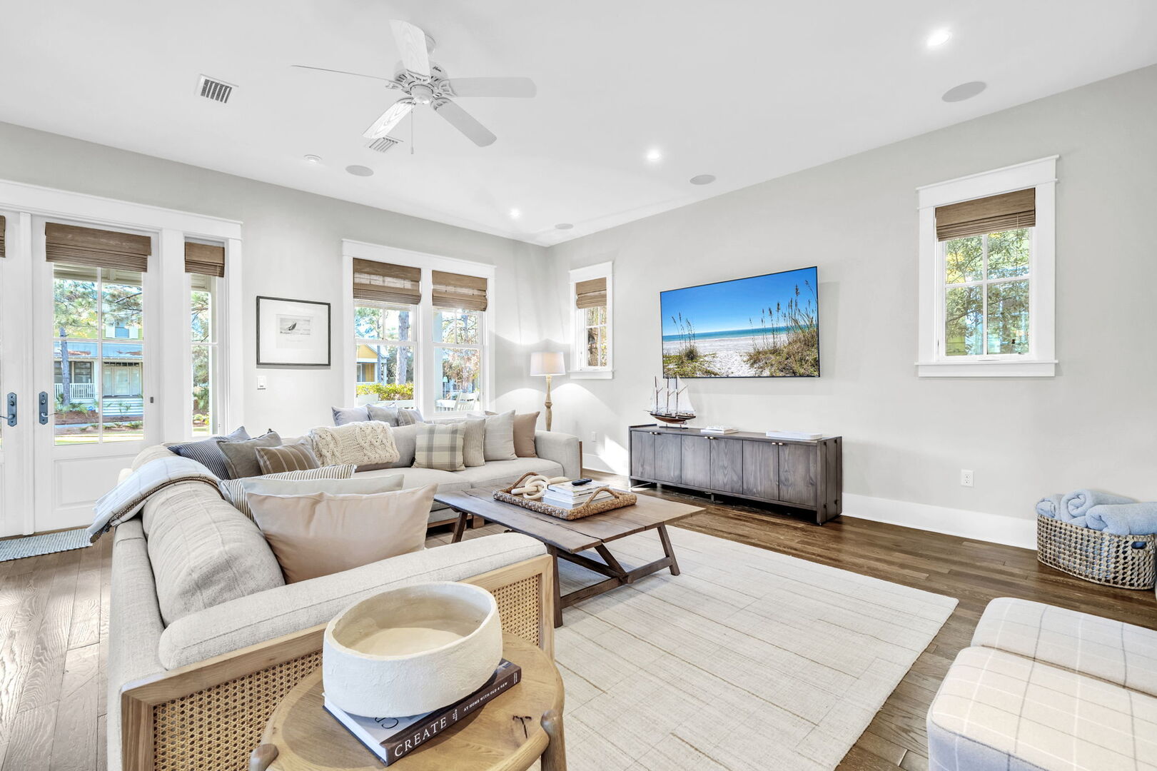 Living room includes plenty of seating and a smart tv for unwinding in the evenings.