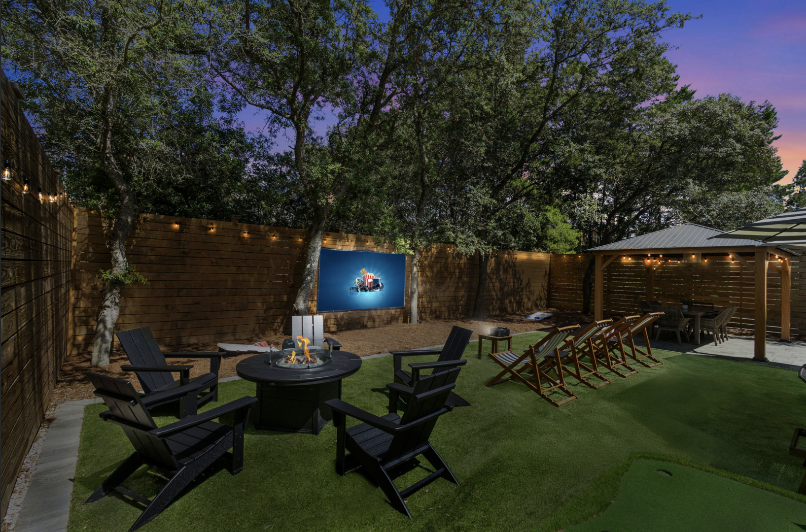 Backyard features firepit and movie projector!